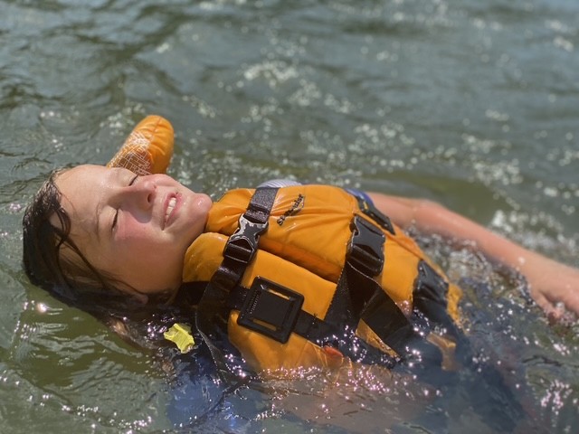 a person swimming in a body of water