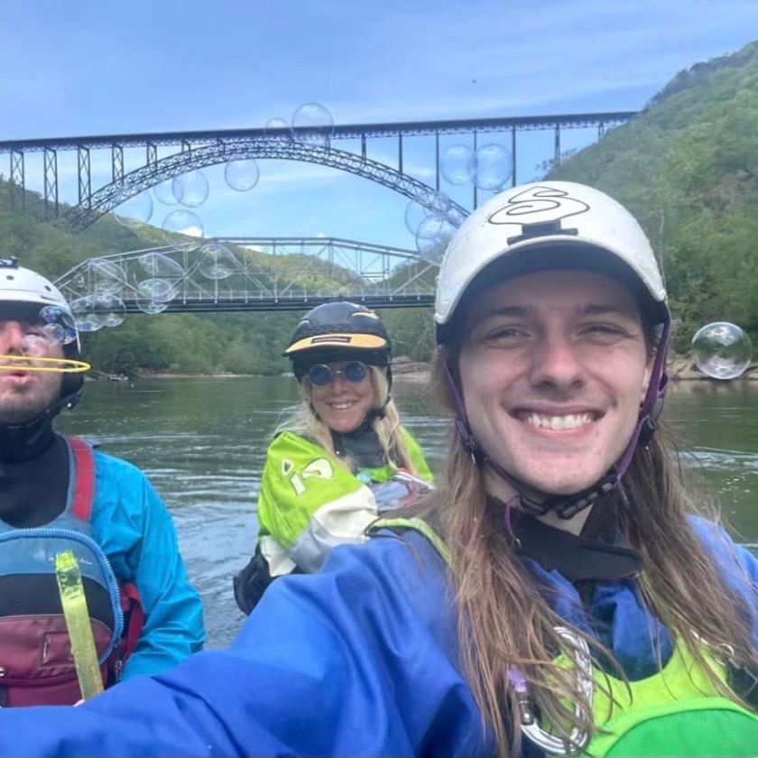 a group of people on a raft in a body of water