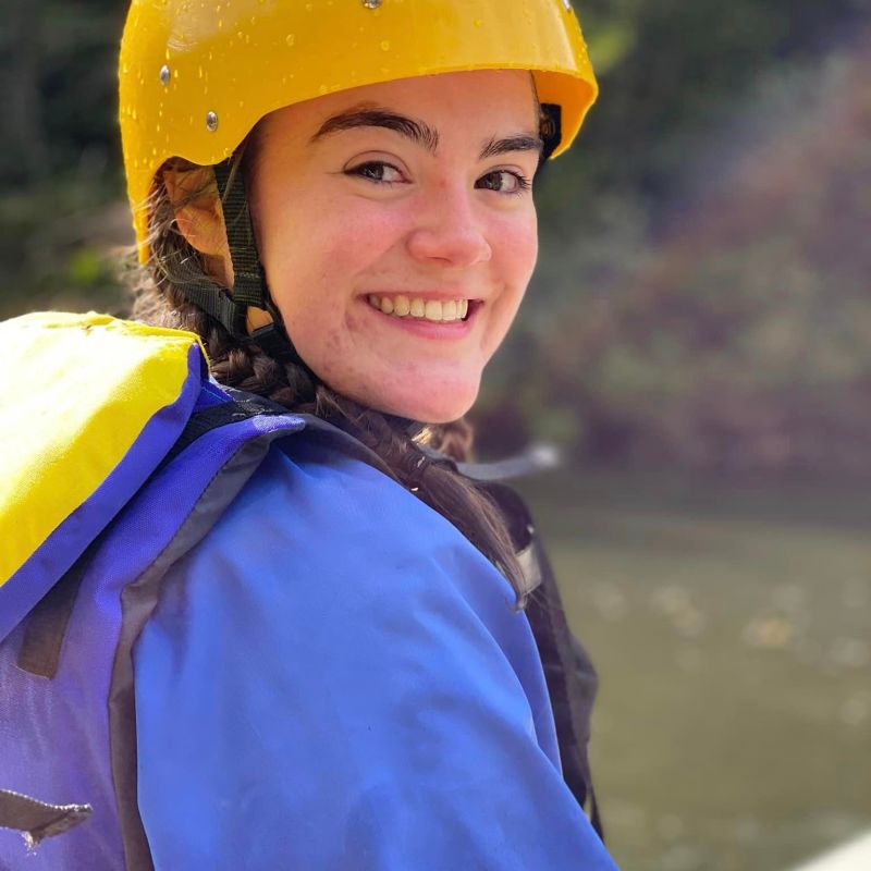 a young girl wearing a hat