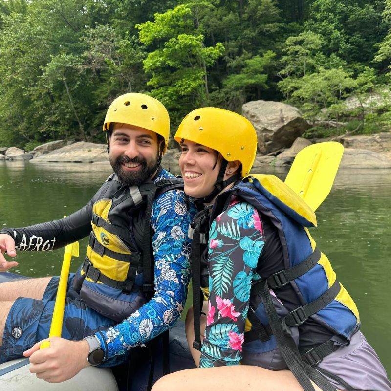 a person sitting on a raft in a body of water