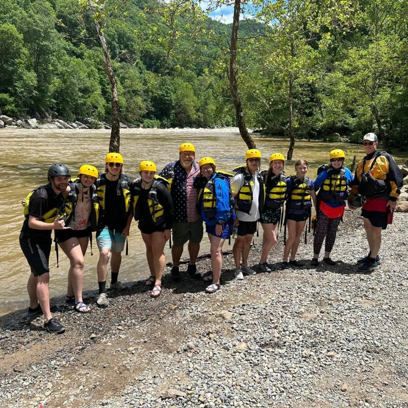 a group of people that are standing in the dirt