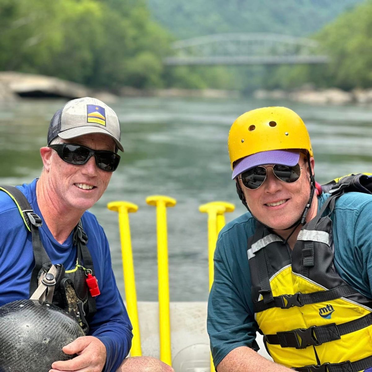 a group of people on a raft in a body of water