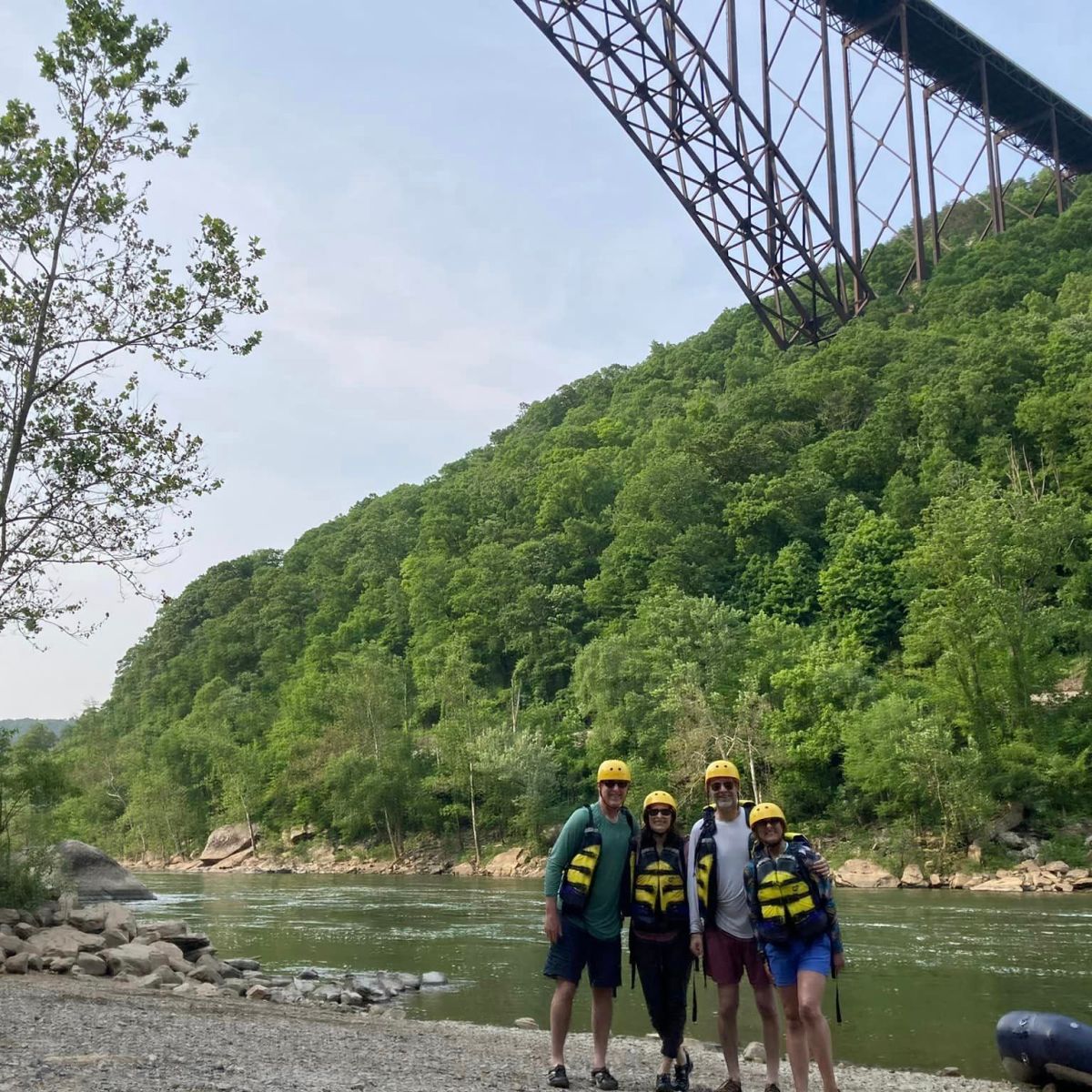 a group of people on a bridge over a body of water