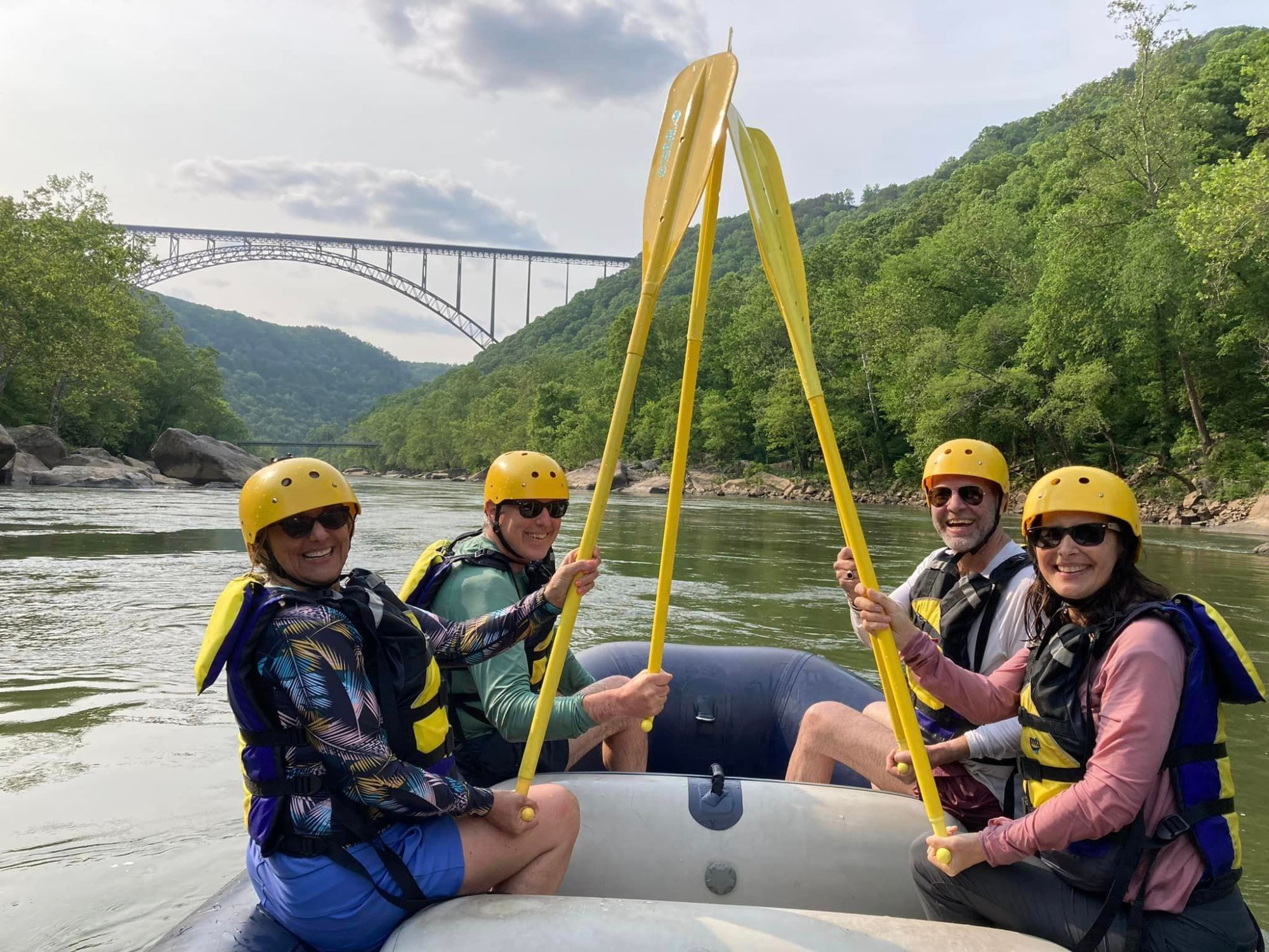 a group of people sitting on a boat in the water