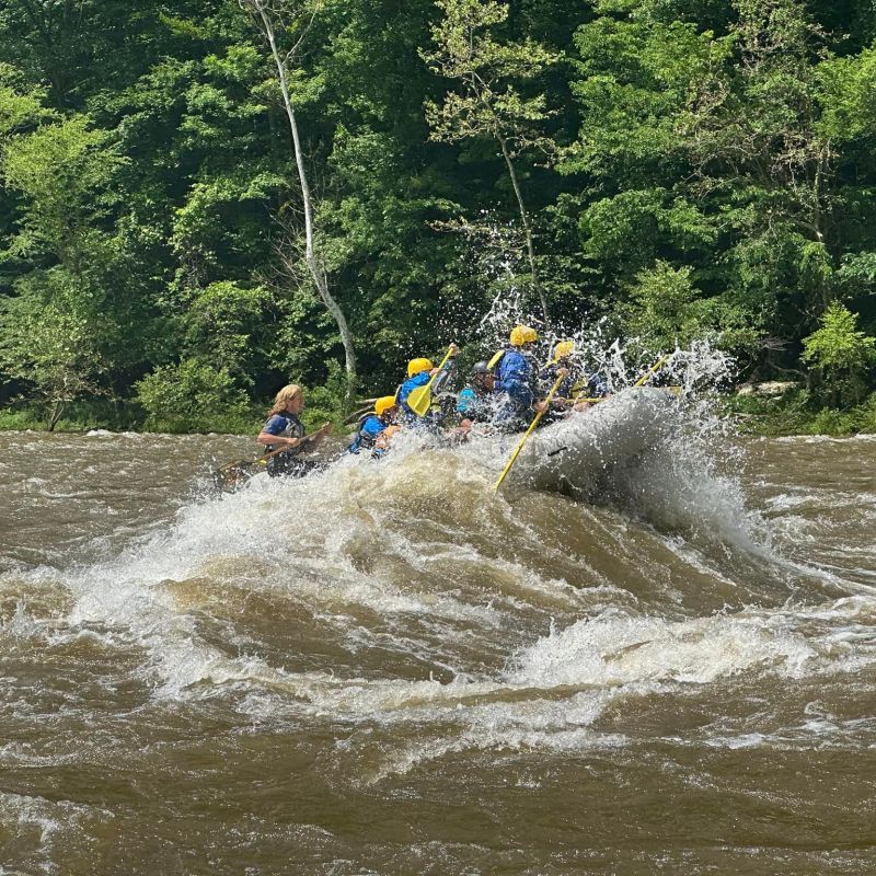 a man riding a wave on a surfboard in the water