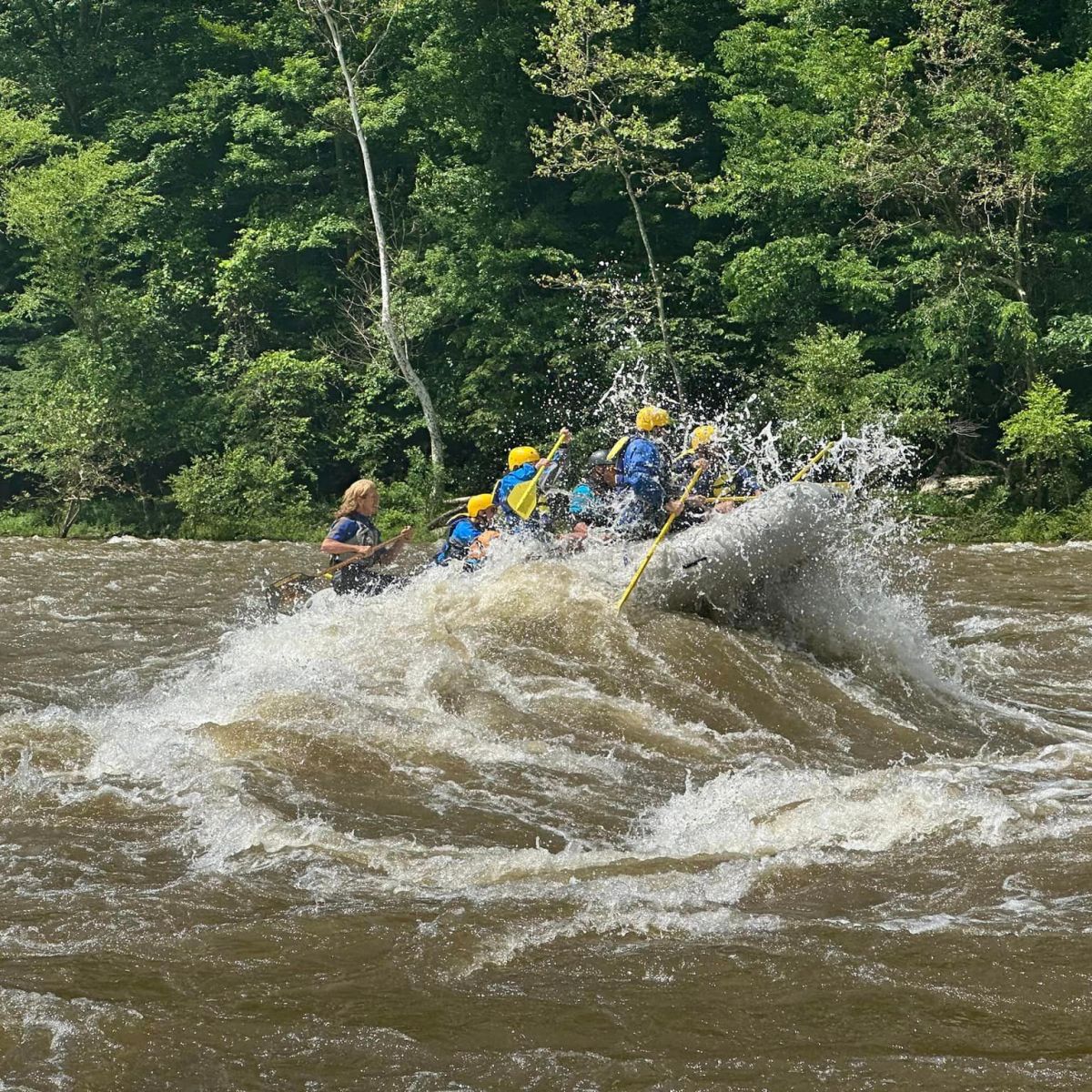 a man riding a wave on a surfboard in the water