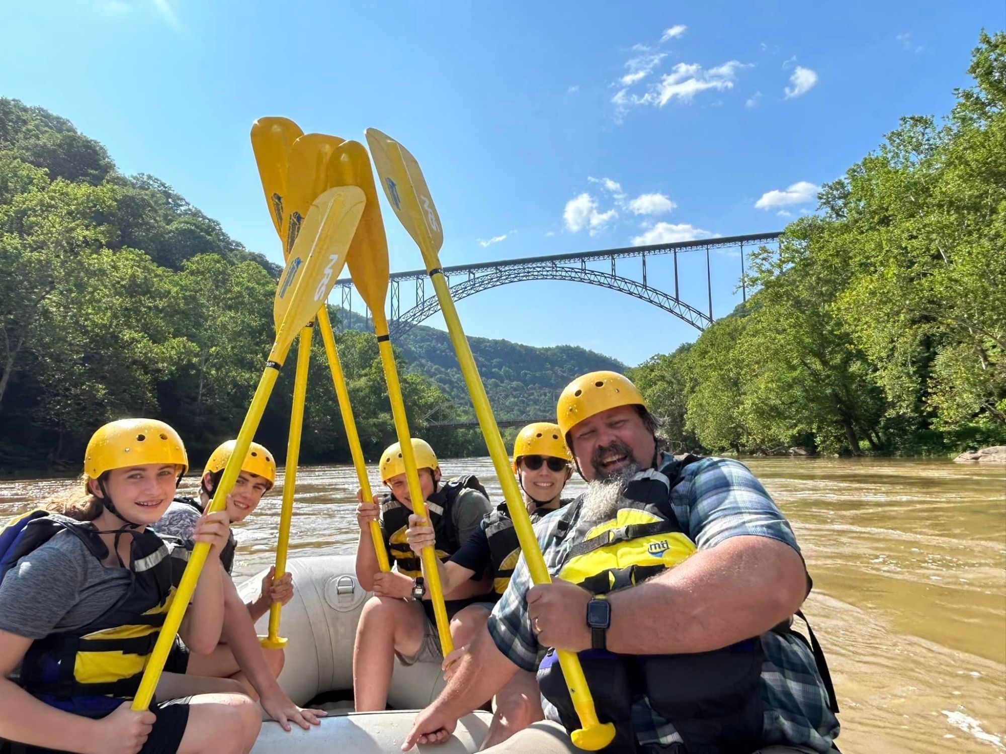 a group of people riding on the back of a boat