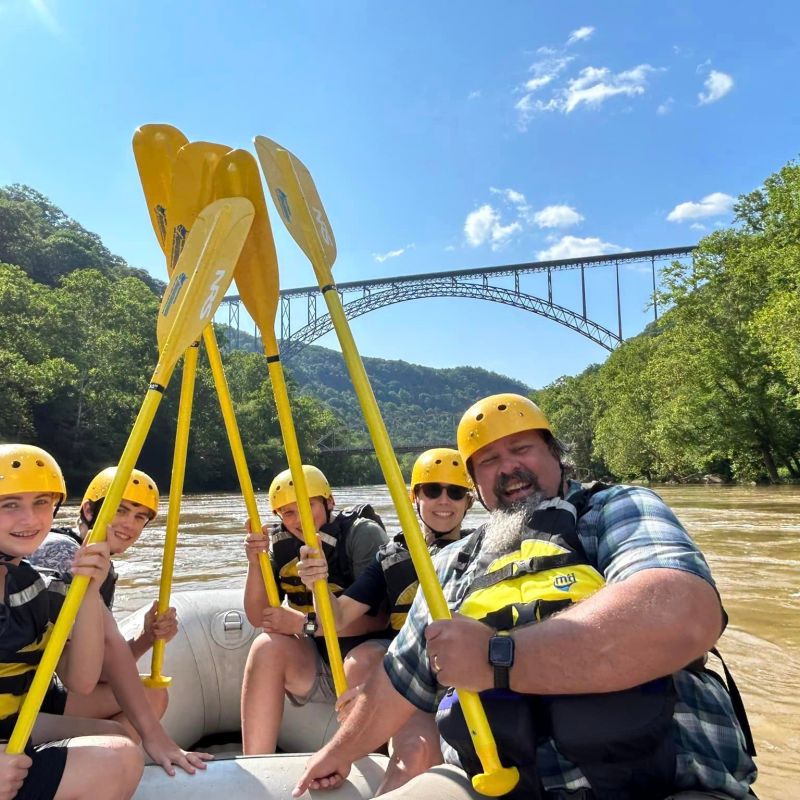 a group of people riding on the back of a boat