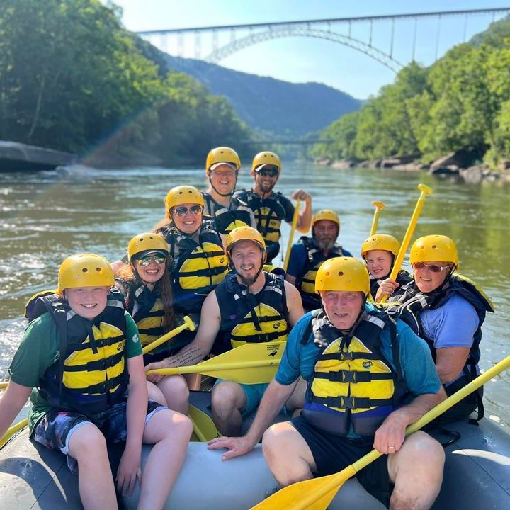 a group of people on a raft in a body of water