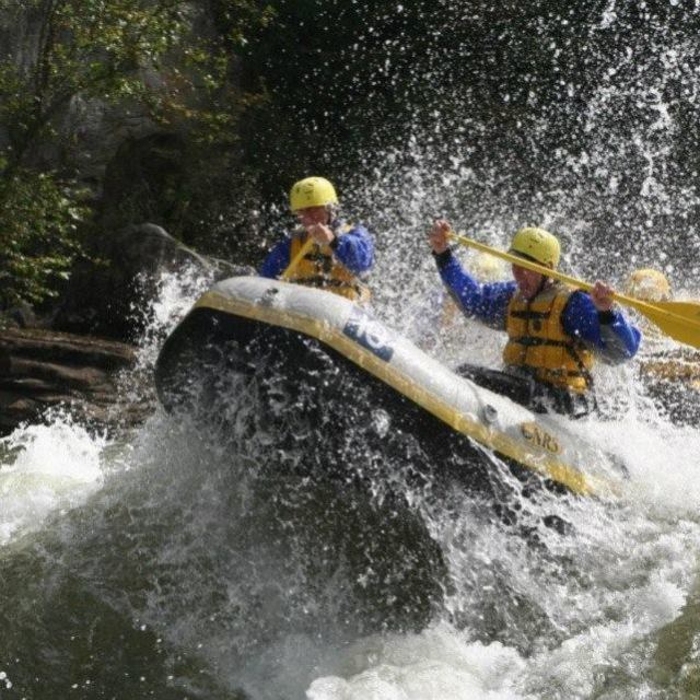 a man riding a wave on a surfboard in the water