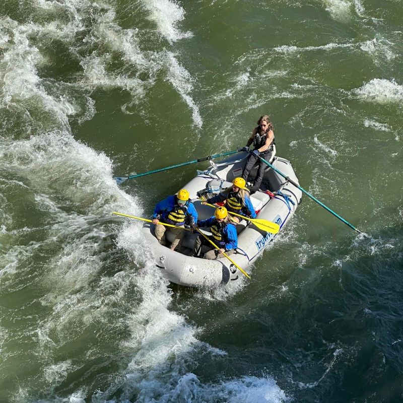 a man riding a wave on a surf board on a body of water