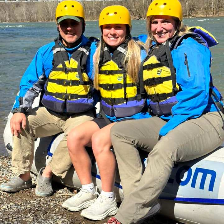 a group of people sitting on a bench