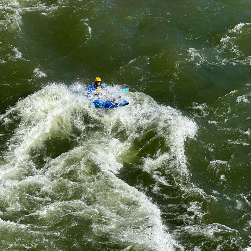a man riding a wave on a surfboard in the water