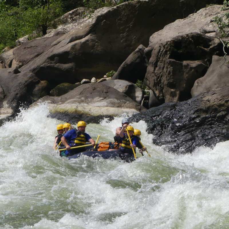 a man riding on a raft in the water