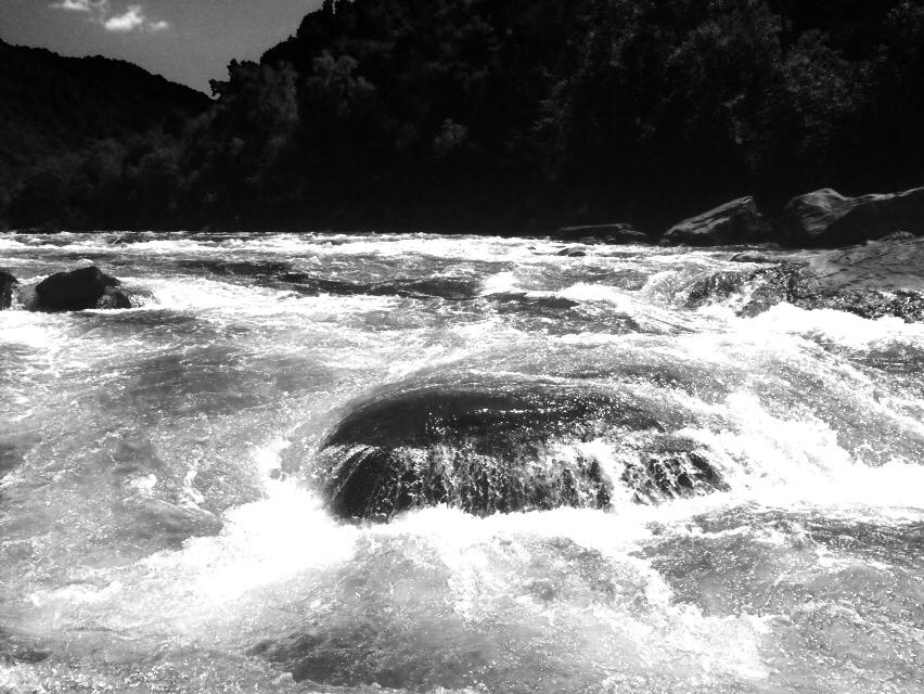 a man riding a wave on top of a body of water