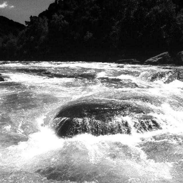 a man riding a wave on top of a body of water