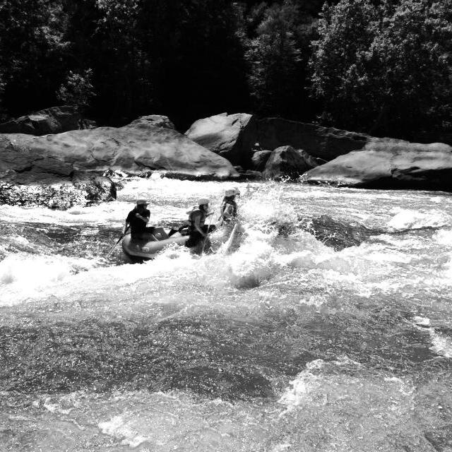 a man riding on top of a snow covered field