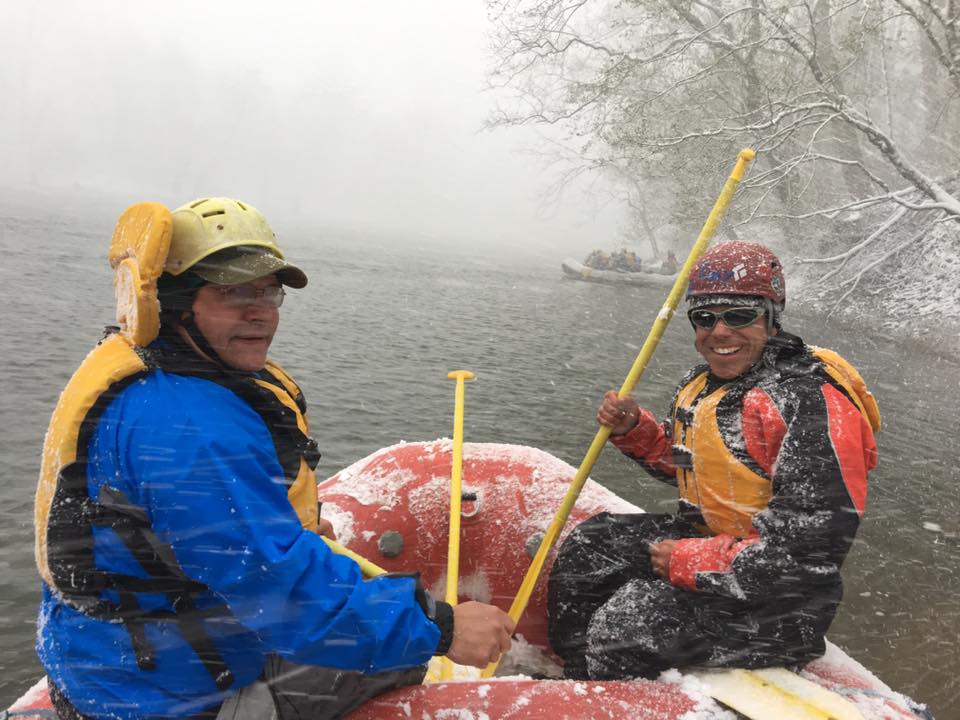a group of people sitting on a raft