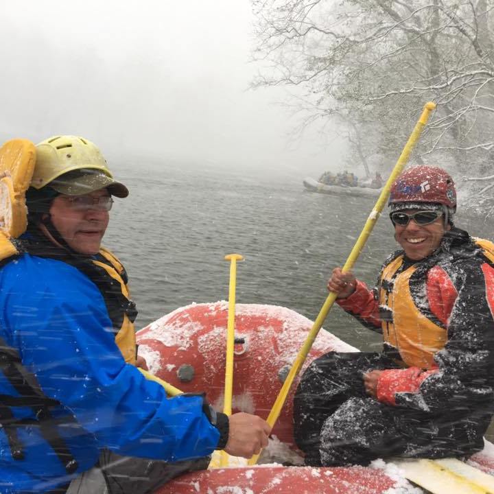a group of people sitting on a raft