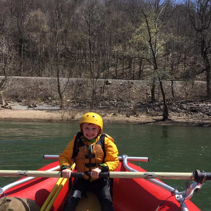 a man rowing a boat in the water