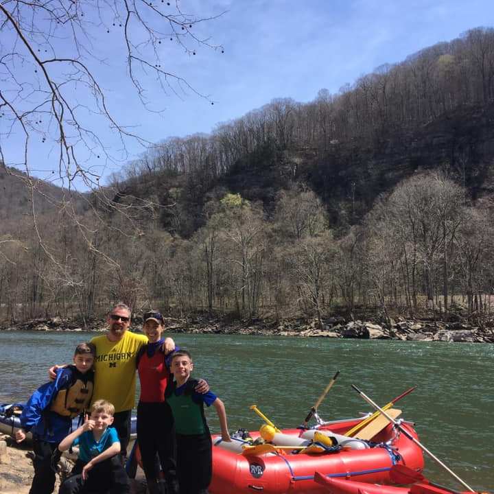 a group of people on a boat in the water