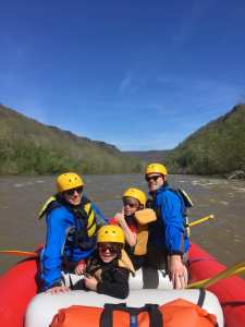 a group of people on a raft