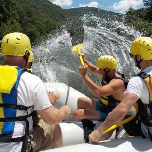 a group of people riding skis on a snowy mountain