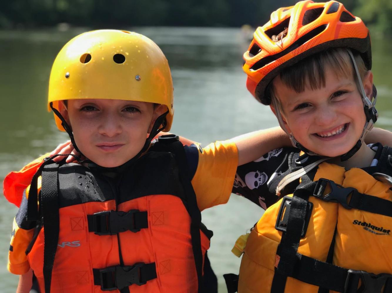 a little boy wearing a helmet