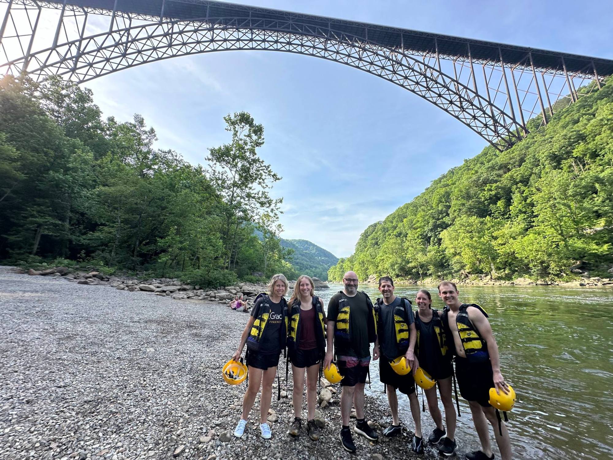 449383874_974059074727657_8371113633719896632_n a group of people crossing a bridge over a body of water