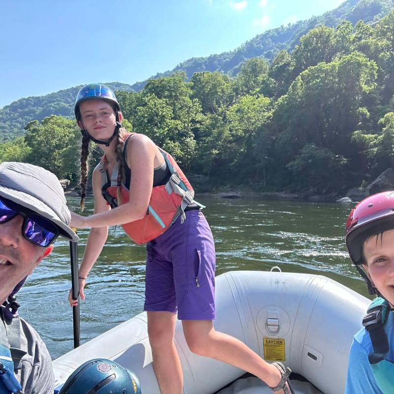 a couple of people that are standing in the water