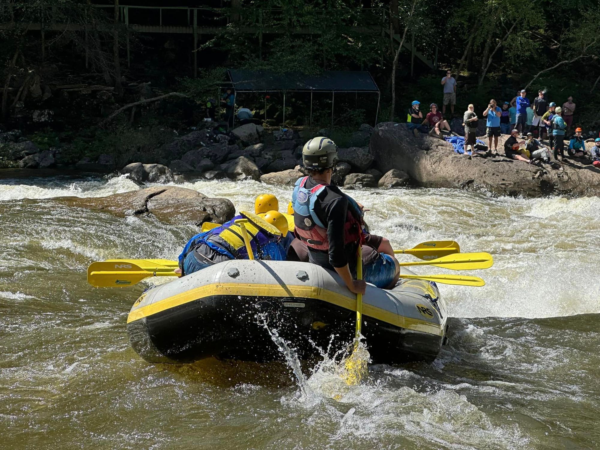 a group of people riding on the back of a boat
