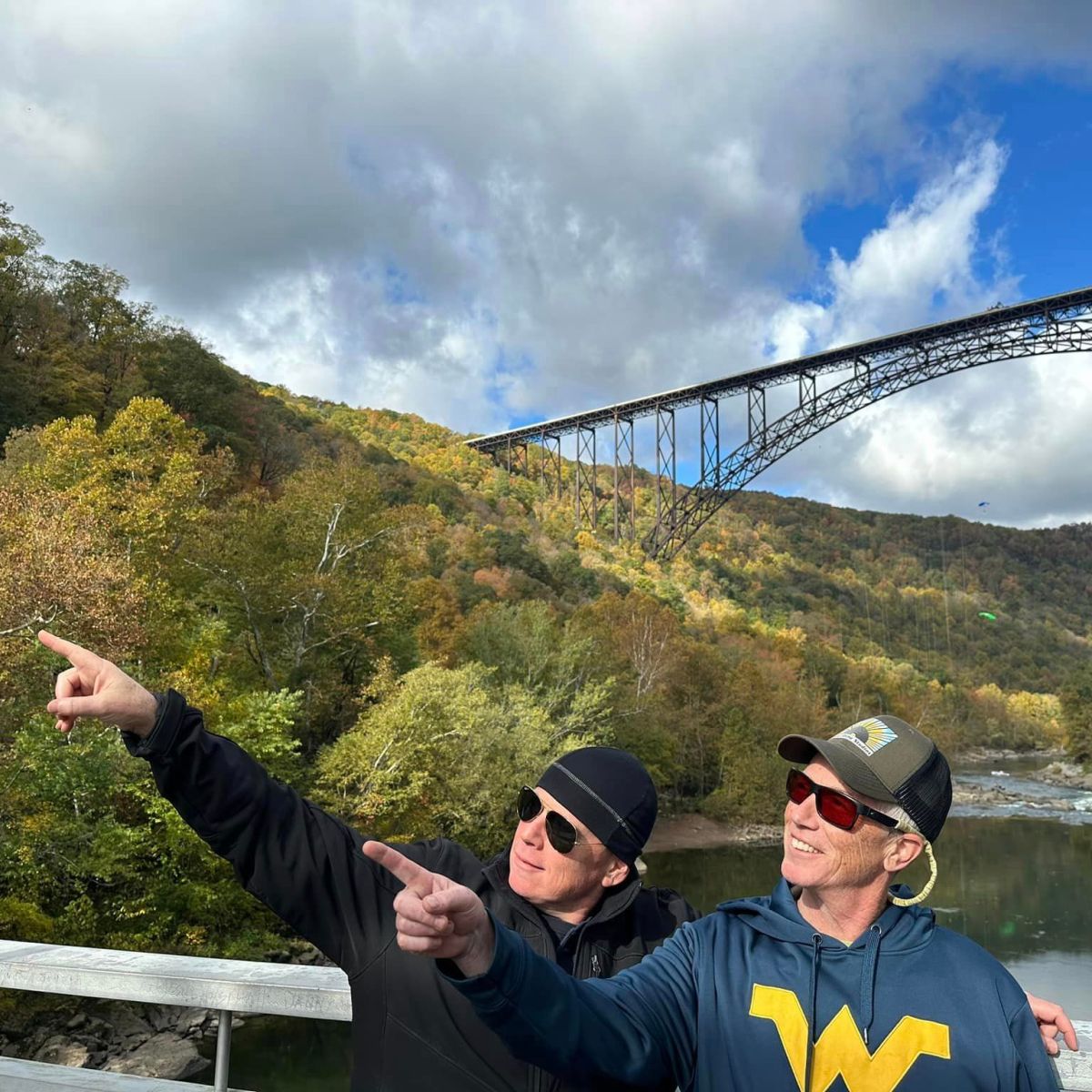 a person standing on a bridge