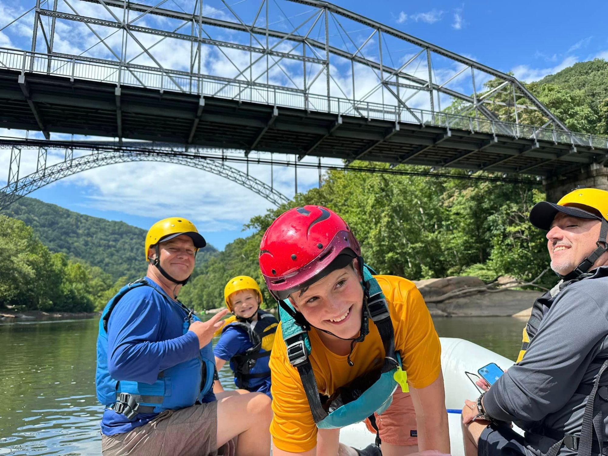 a group of people on a boat in the water