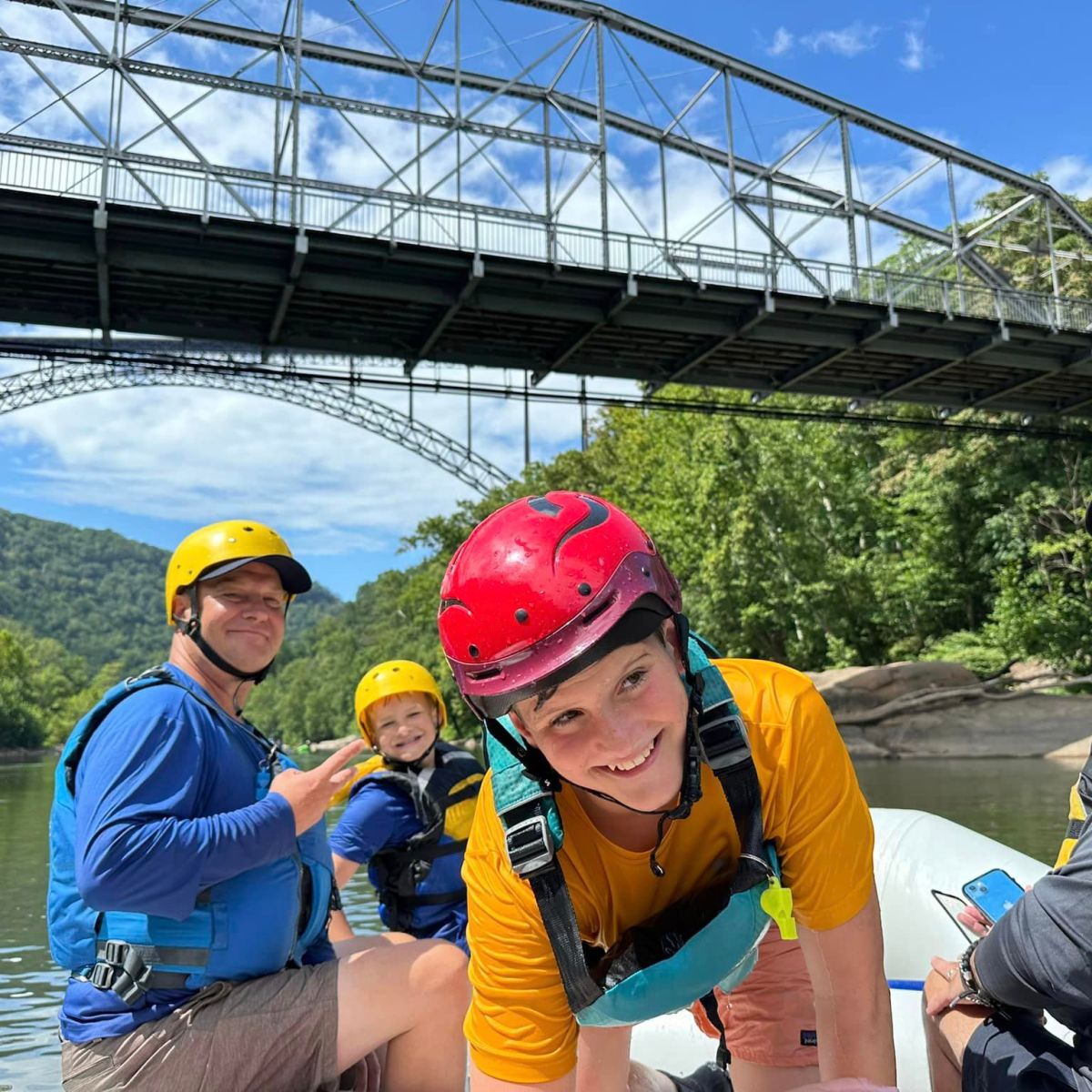 a group of people on a boat in the water