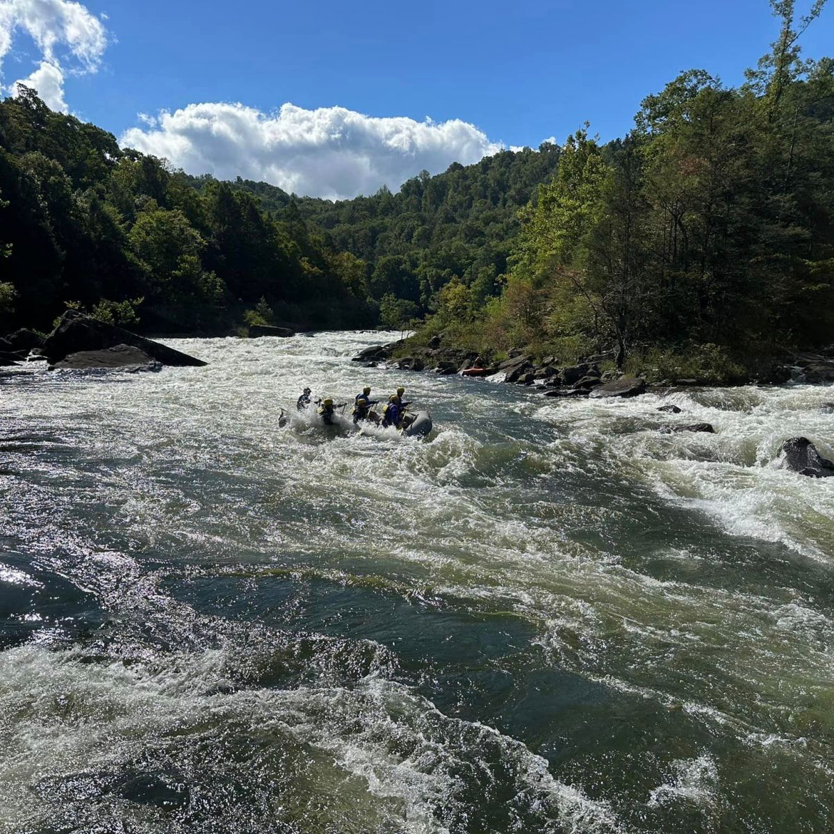 a body of water with a mountain in the background
