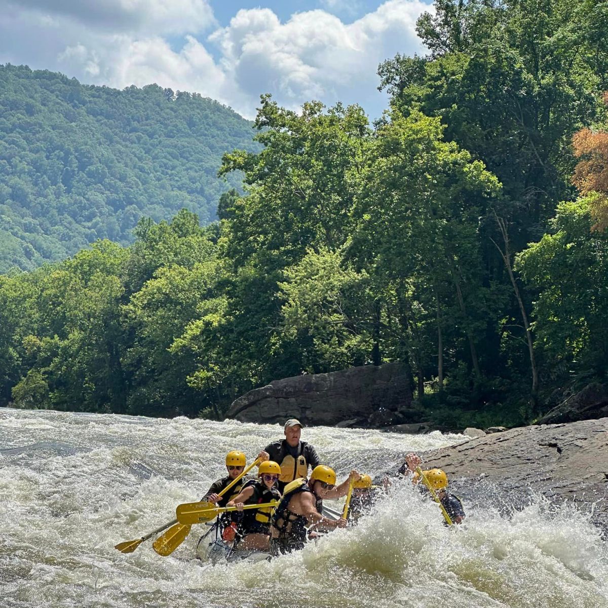a group of people riding skis on a body of water