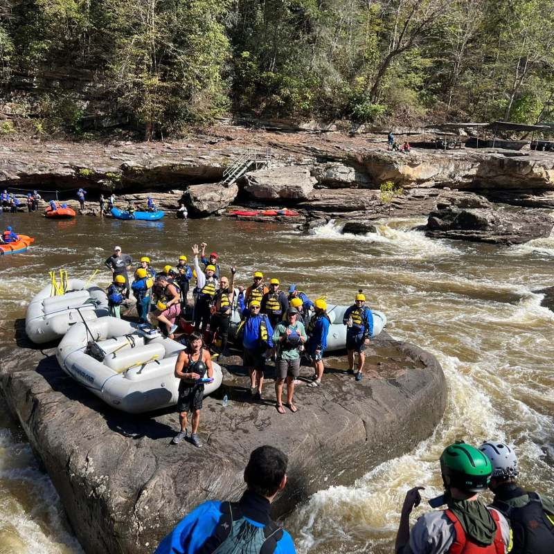 a group of people on a raft