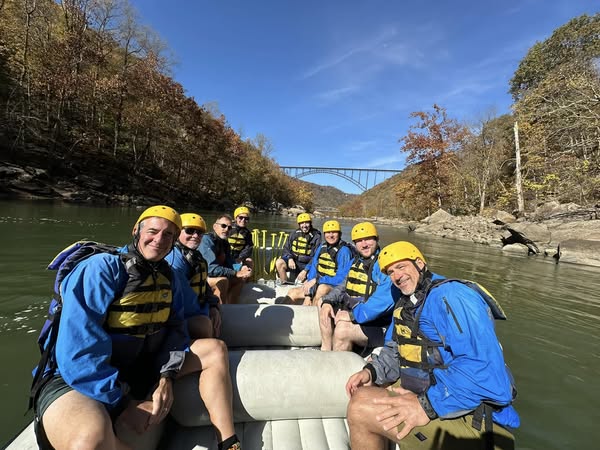a group of people riding on the back of a boat