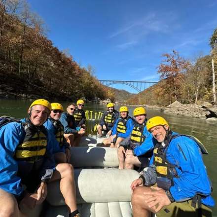 a group of people riding on the back of a boat