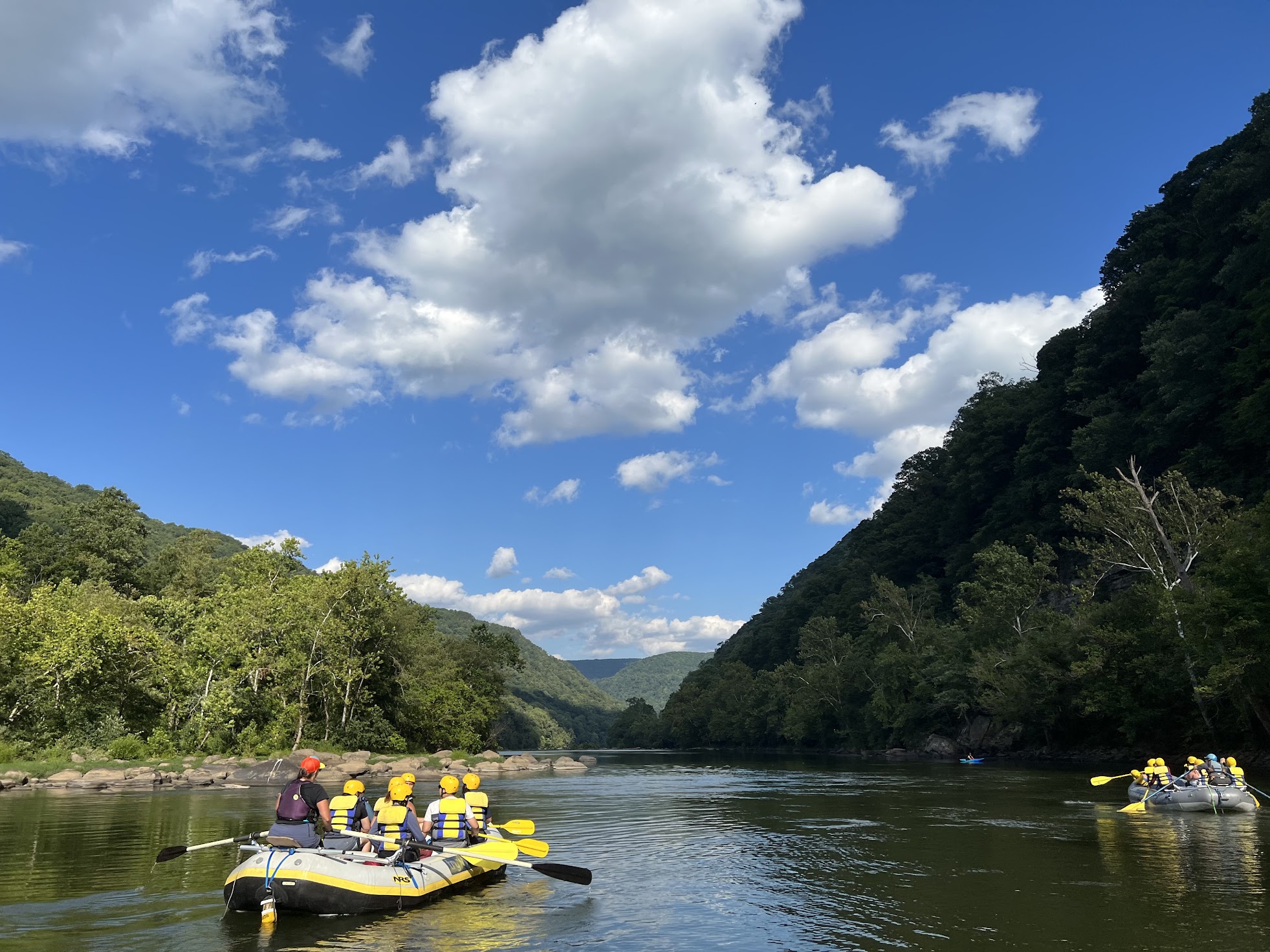 #1 Gentle Float Trips a boat floating along a river next to a body of water