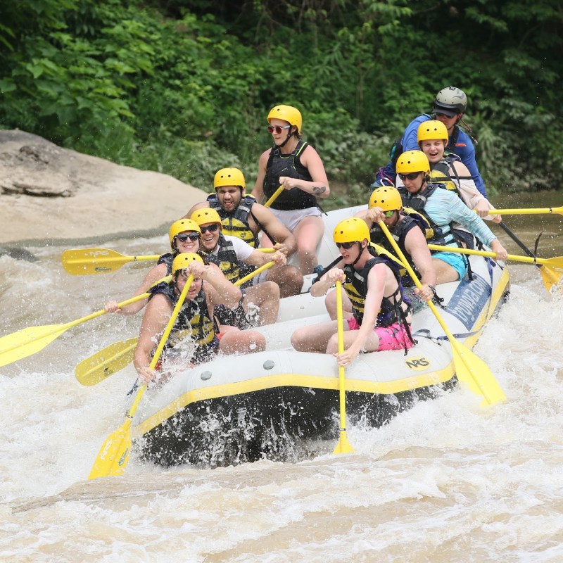 a man riding on the back of a raft