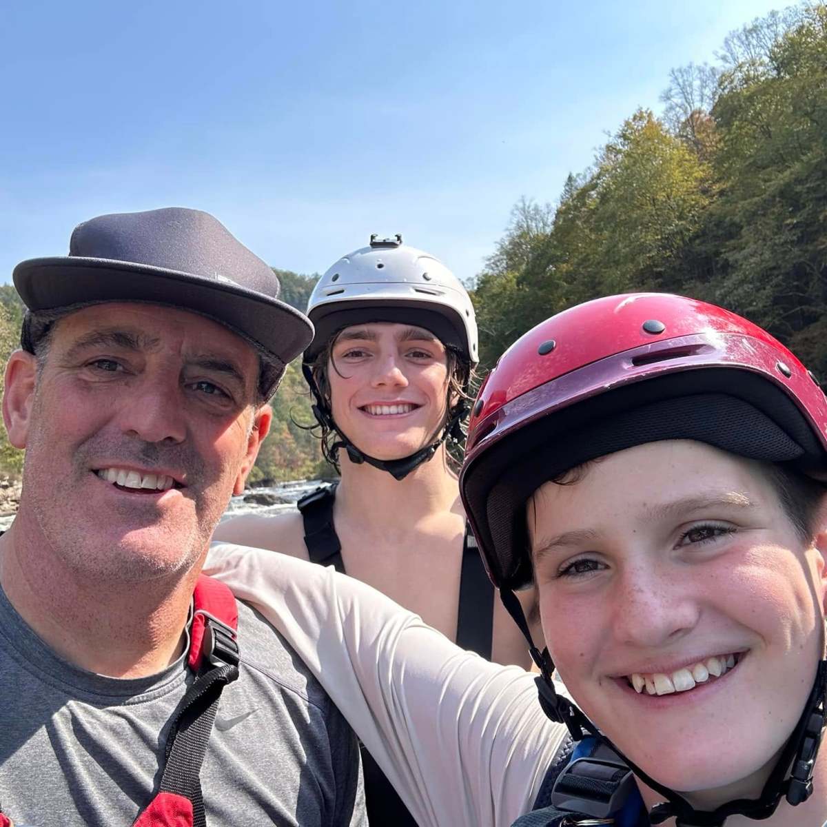 a man wearing a hat posing for the camera