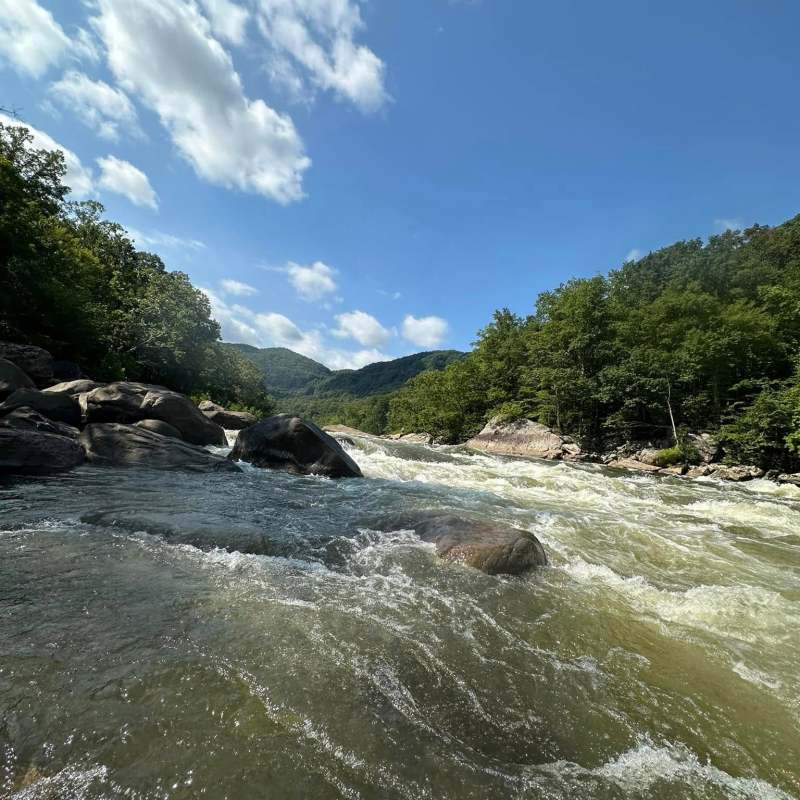 a man riding a wave on top of a body of water