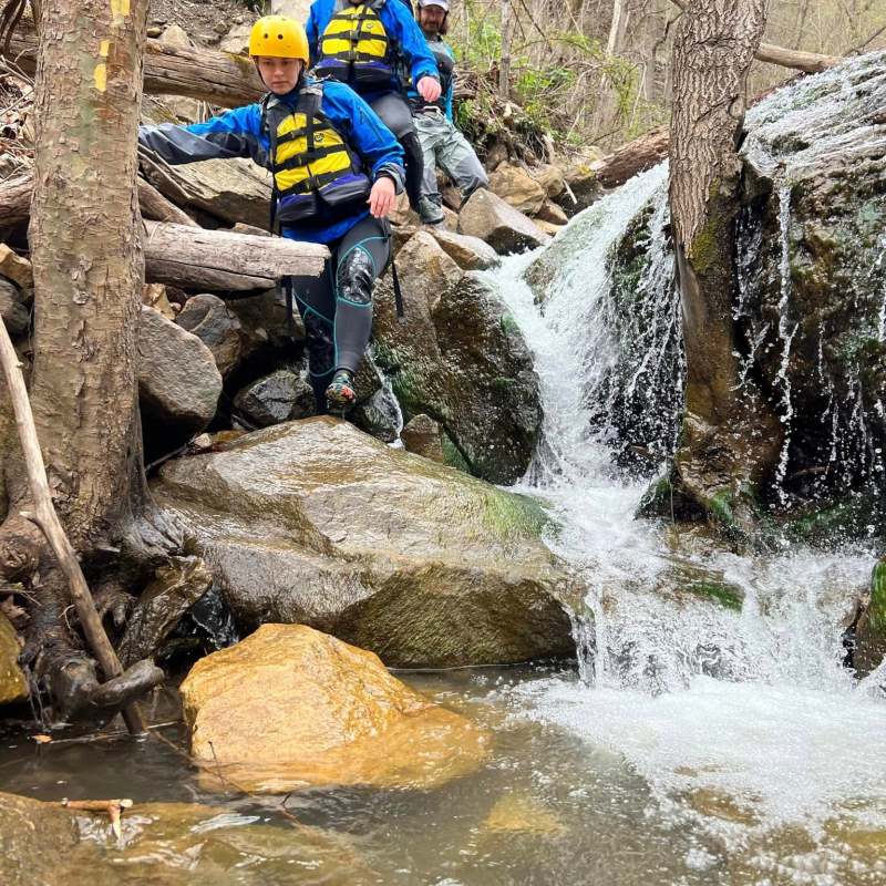 a man riding on the back of a waterfall