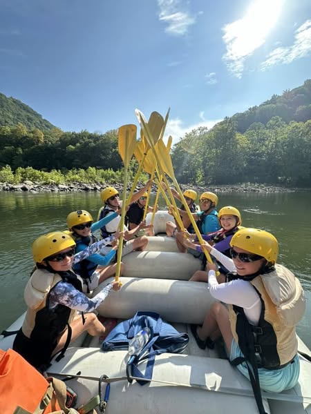 a group of people riding on the back of a boat