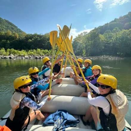 a group of people riding on the back of a boat