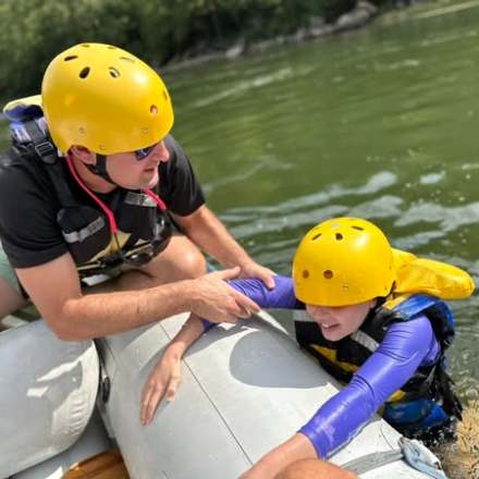 a little boy wearing a helmet