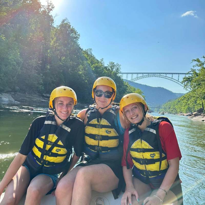 a group of people sitting posing for the camera