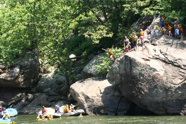 a group of people on a rock
