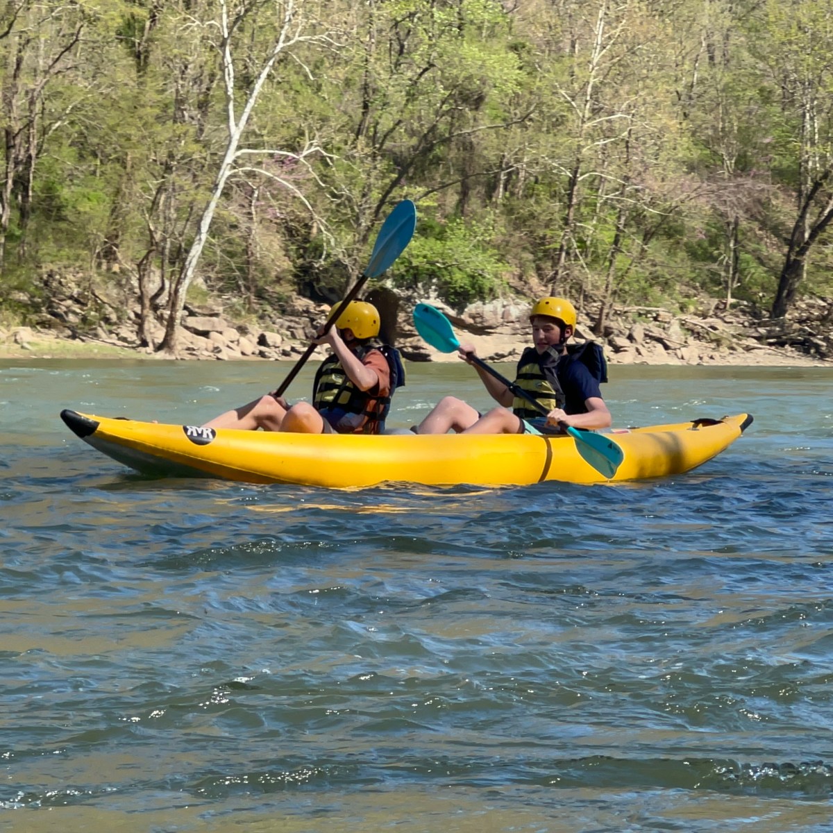 a man riding on a raft in a body of water